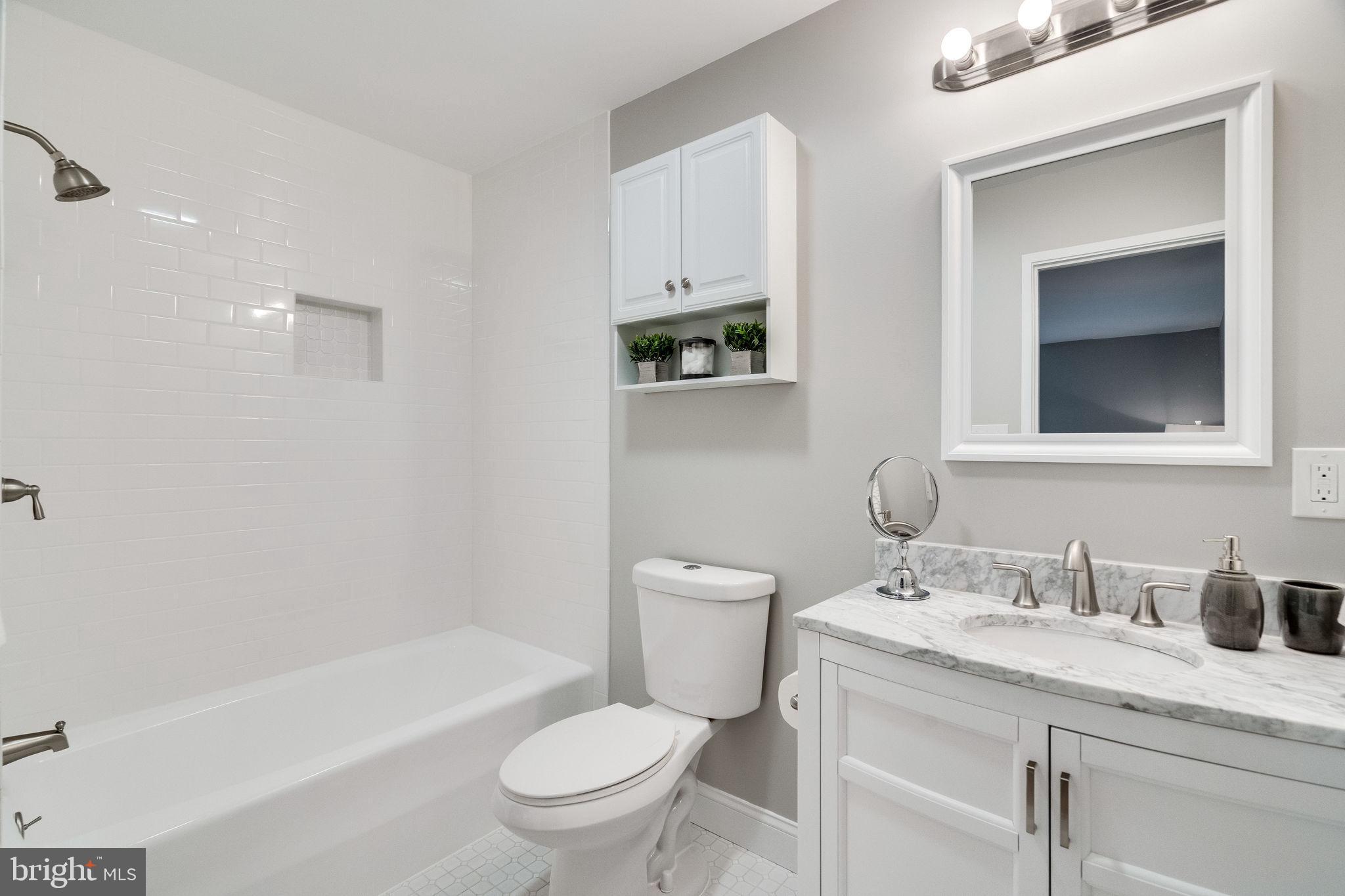 1907 Marthas Road Alexandria, VA 22307 - Photo 13 of 35 Master bathroom has new tile, commode and vanity