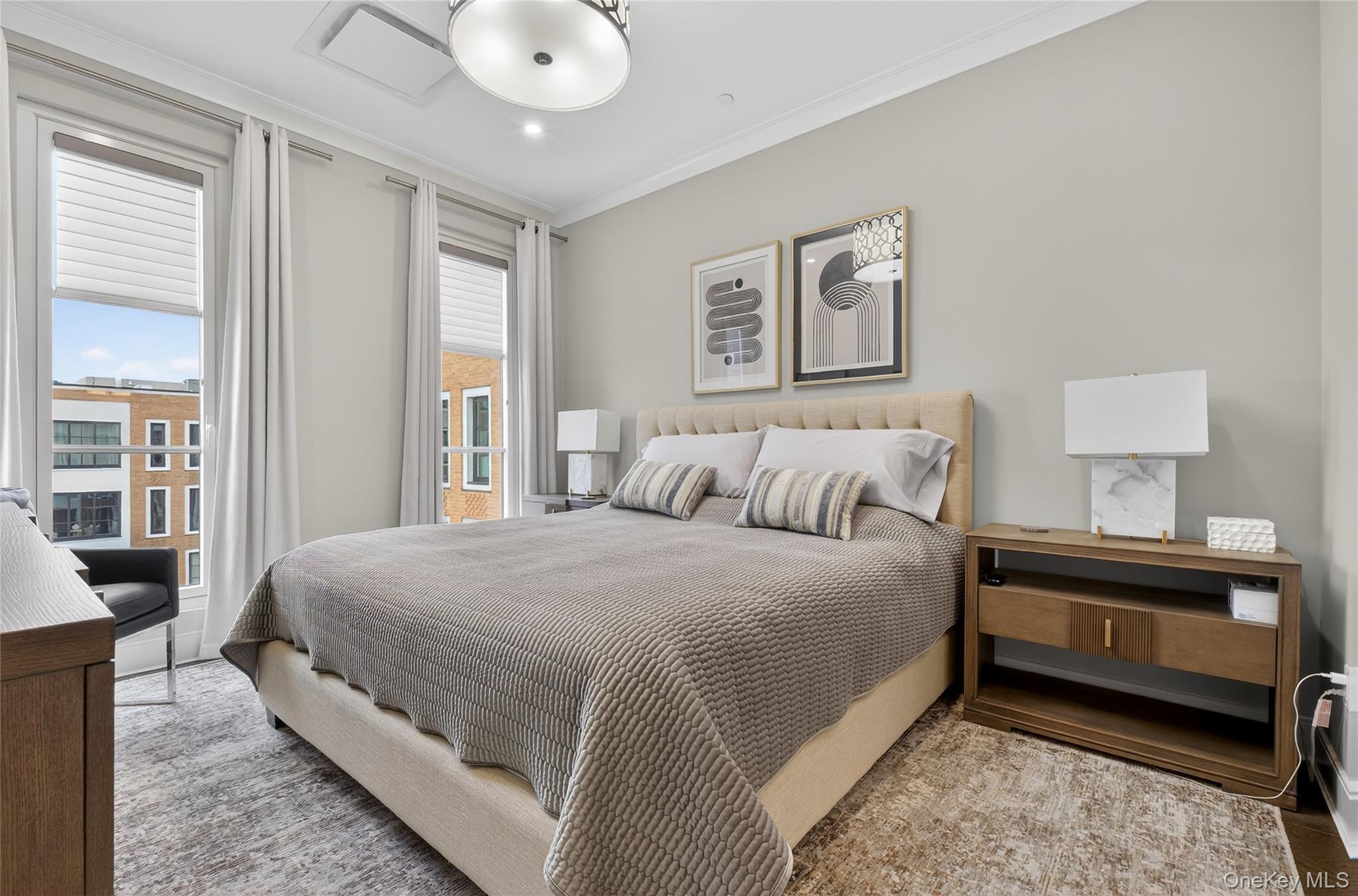 100 Garvies Point Road, Unit 1332 Glen Cove, NY 11542 - Photo 14 of 45 a spacious bedroom with a bed and window