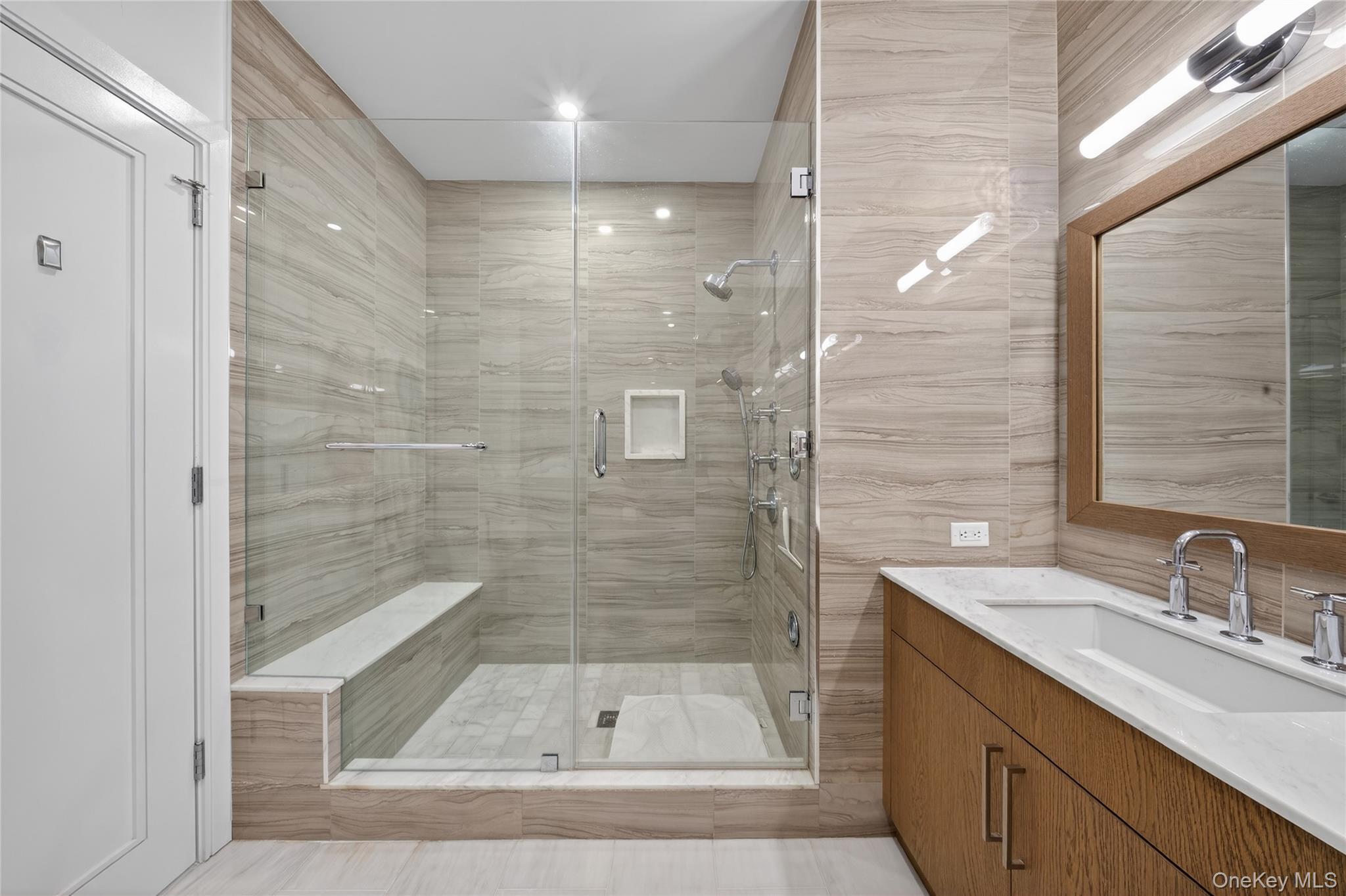 100 Garvies Point Road, Unit 1332 Glen Cove, NY 11542 - Photo 20 of 45 a bathroom with a shower and a sink