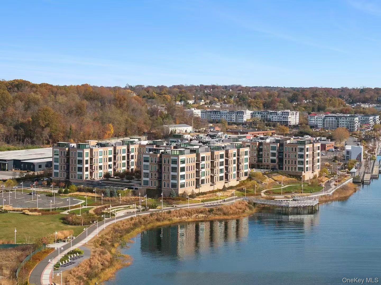 100 Garvies Point Road, Unit 1332 Glen Cove, NY 11542 - Photo 26 of 45 a view of a lake with a mountain