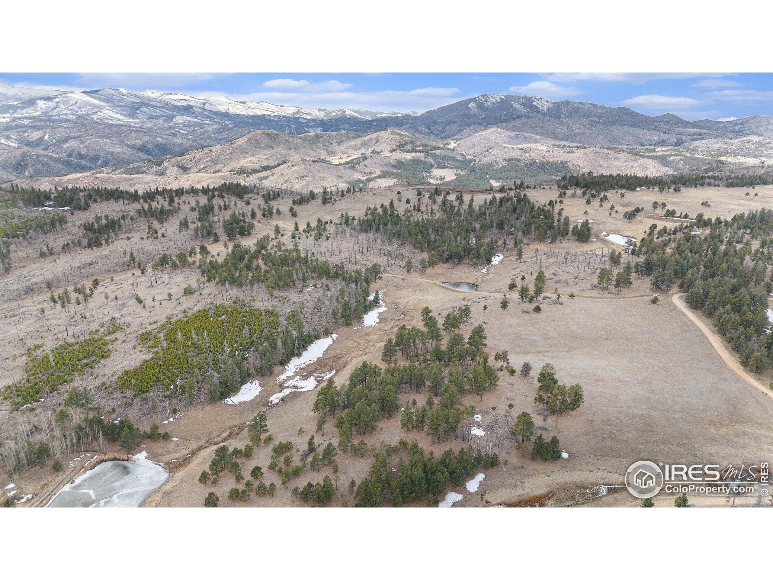 0 Tip Top Road Bellvue, CO 80512 - Photo 3 of 18 a black and white photo of a lake