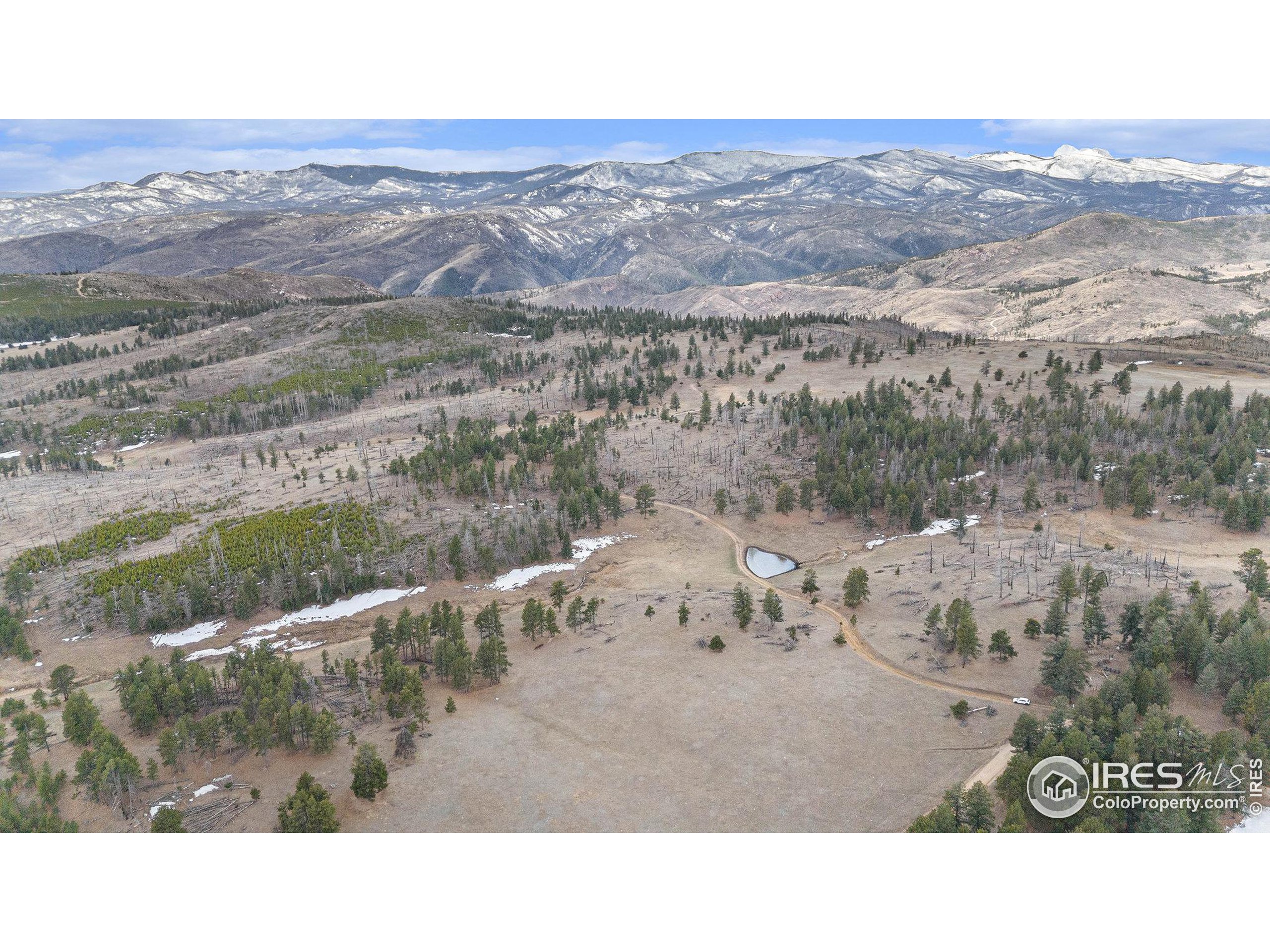 0 Tip Top Road Bellvue, CO 80512 - Photo 6 of 18 a black and white photo of a lake