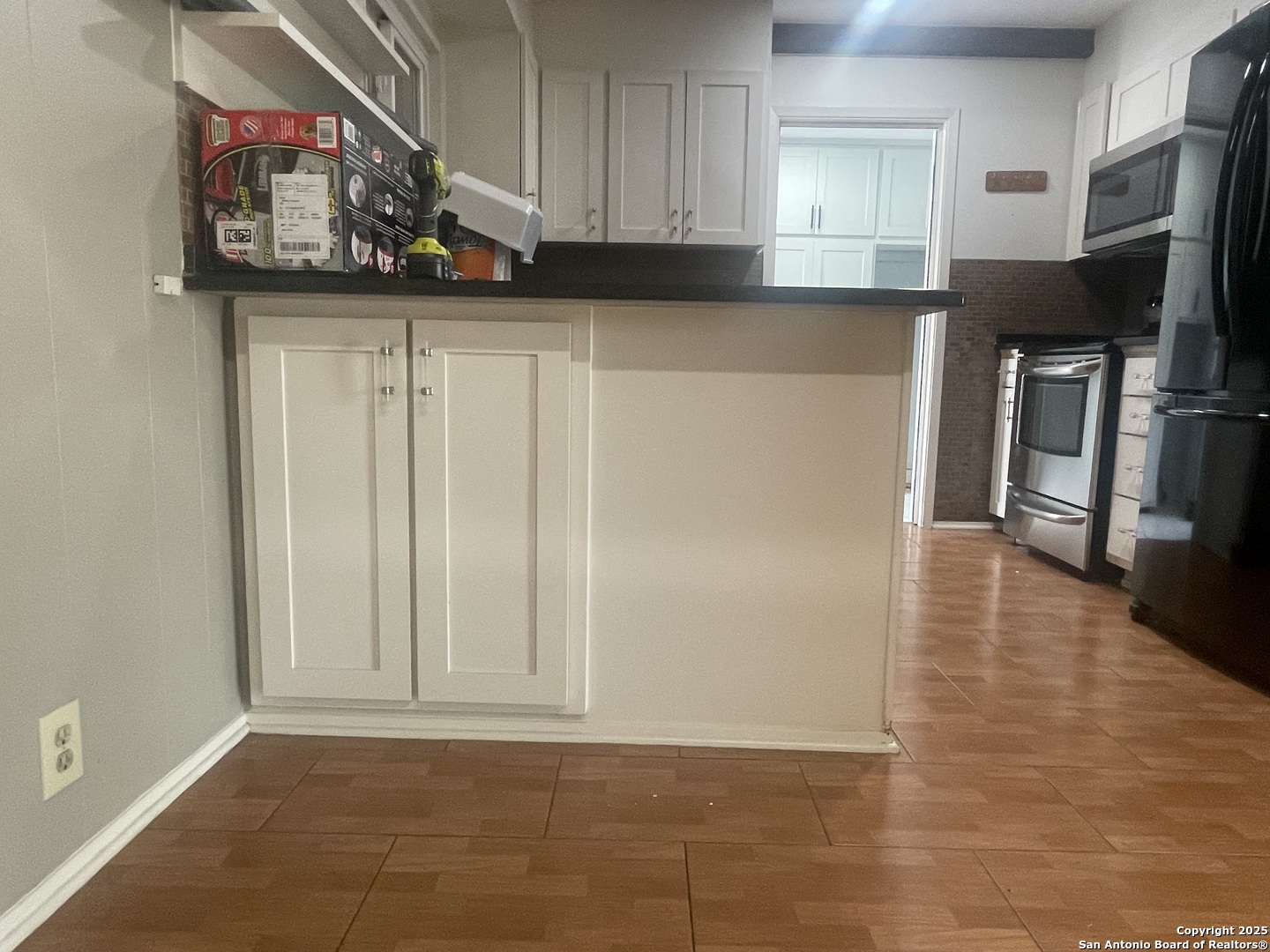 9411 Wahada Avenue San Antonio, TX 78217 - Photo 11 of 49 a kitchen with stainless steel appliances a refrigerator and a stove