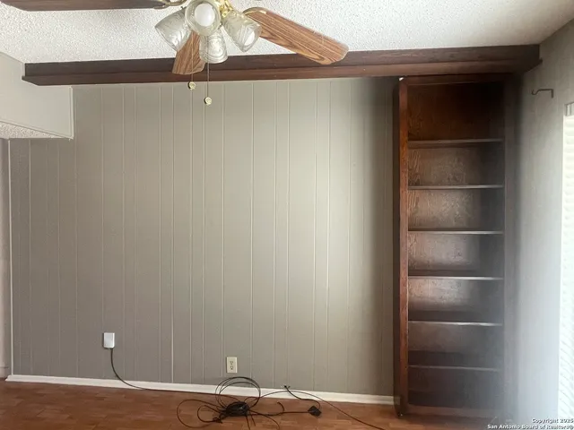 a view of a room with a wooden floor