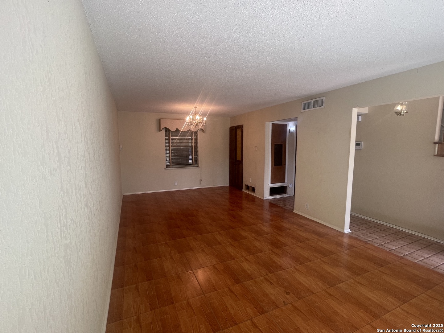 9411 Wahada Avenue San Antonio, TX 78217 - Photo 17 of 49 a view of empty room with wooden floor