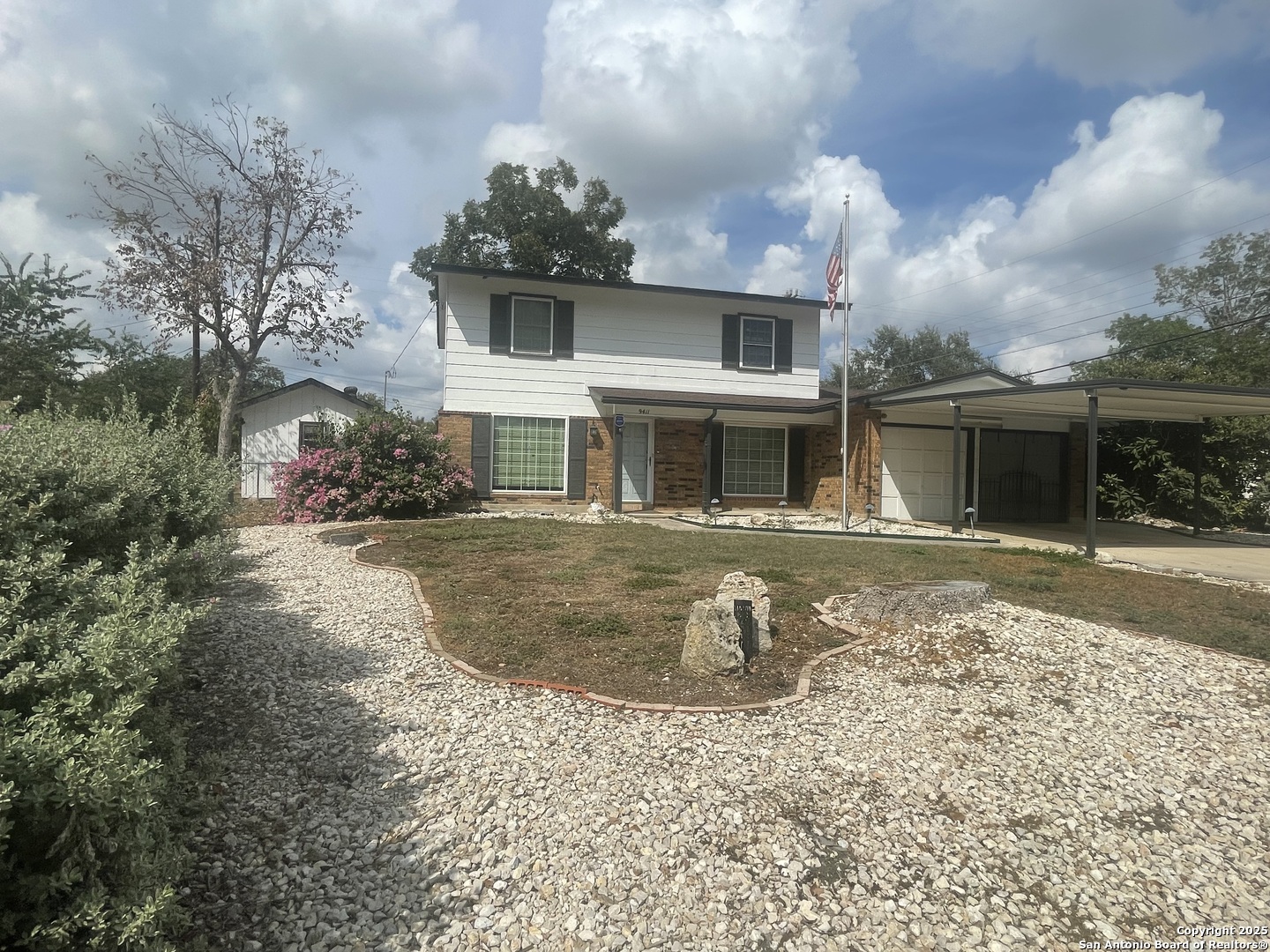 9411 Wahada Avenue San Antonio, TX 78217 - Photo 2 of 49 a view of a house with a yard