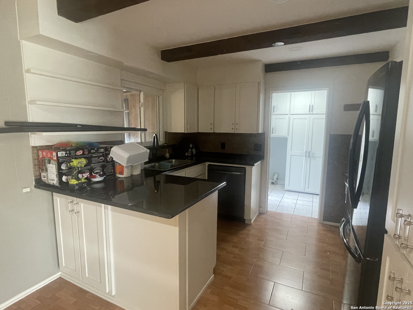 9411 Wahada Avenue San Antonio, TX 78217 - Photo 6 of 49 a kitchen with stainless steel appliances a sink stove and refrigerator