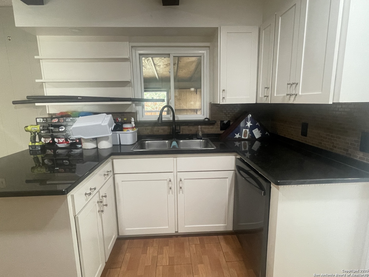 9411 Wahada Avenue San Antonio, TX 78217 - Photo 9 of 49 a kitchen with a sink and cabinets