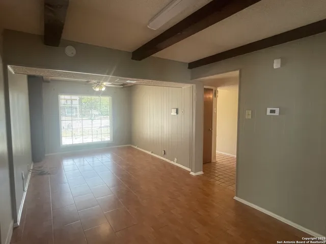 a view of an empty room and window