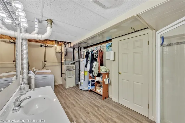 a view of a bedroom with furniture and windows