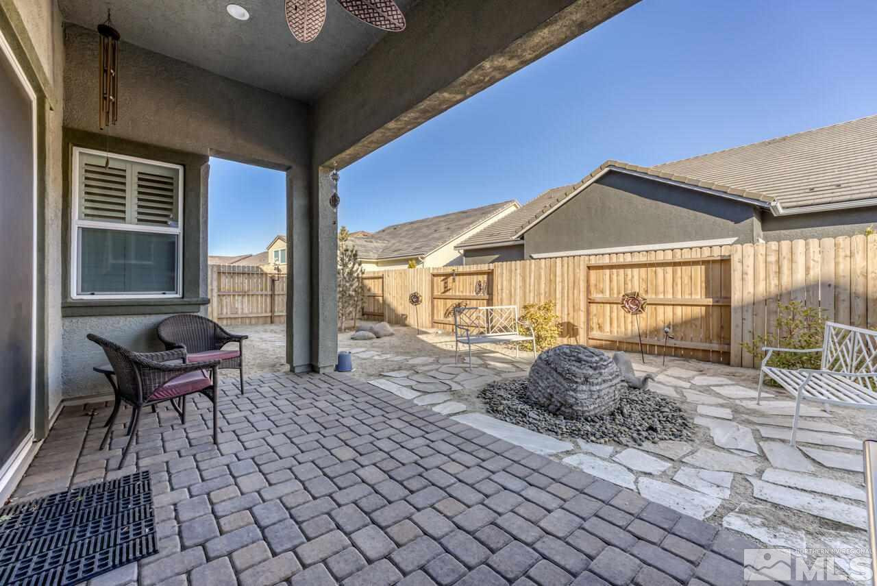 9470 Baldacci Road Reno, NV 89521 - Photo 30 of 35 a front view of house with yard outdoor seating and barbeque oven