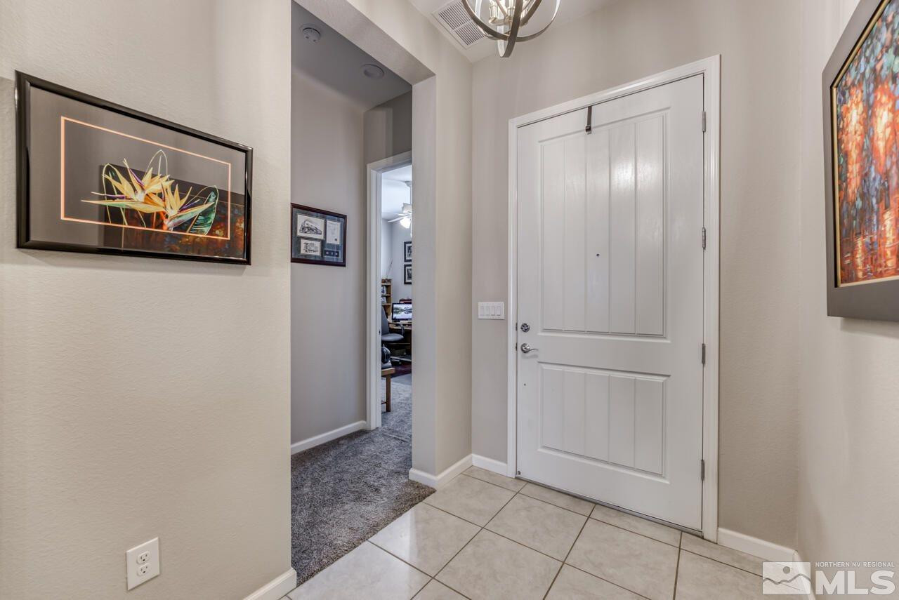 9470 Baldacci Road Reno, NV 89521 - Photo 3 of 35 a view of an entryway with wooden floor