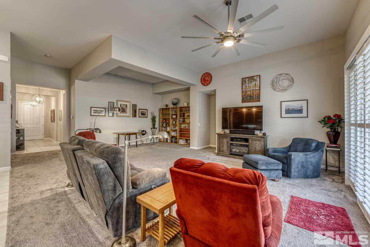 9470 Baldacci Road Reno, NV 89521 - Photo 9 of 35 a living room with furniture a flat screen tv and a window
