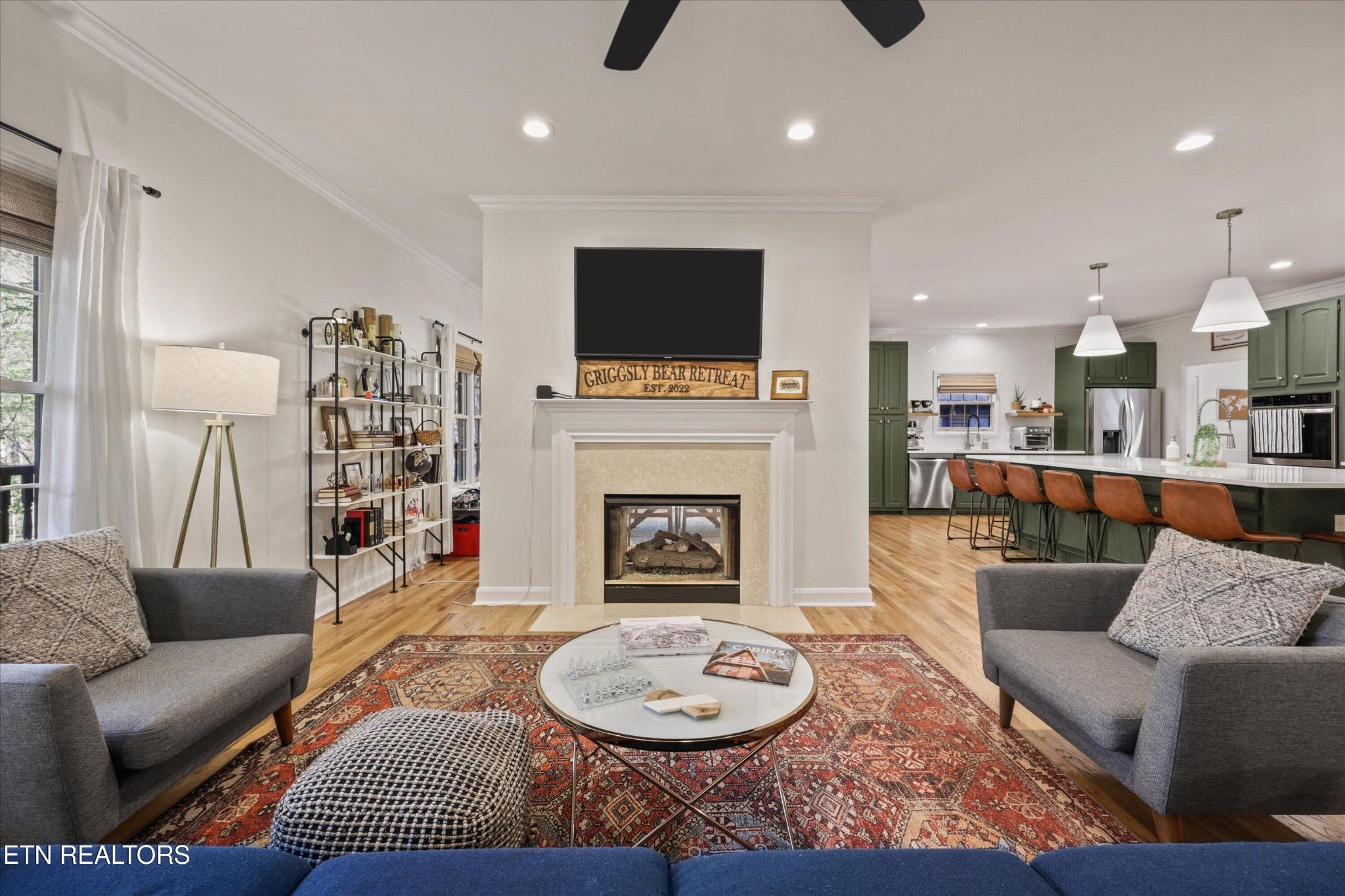 257 Lone Ridge Lane Heiskell, TN 37754 - Photo 14 of 60 a living room with furniture a flat screen tv and a fireplace