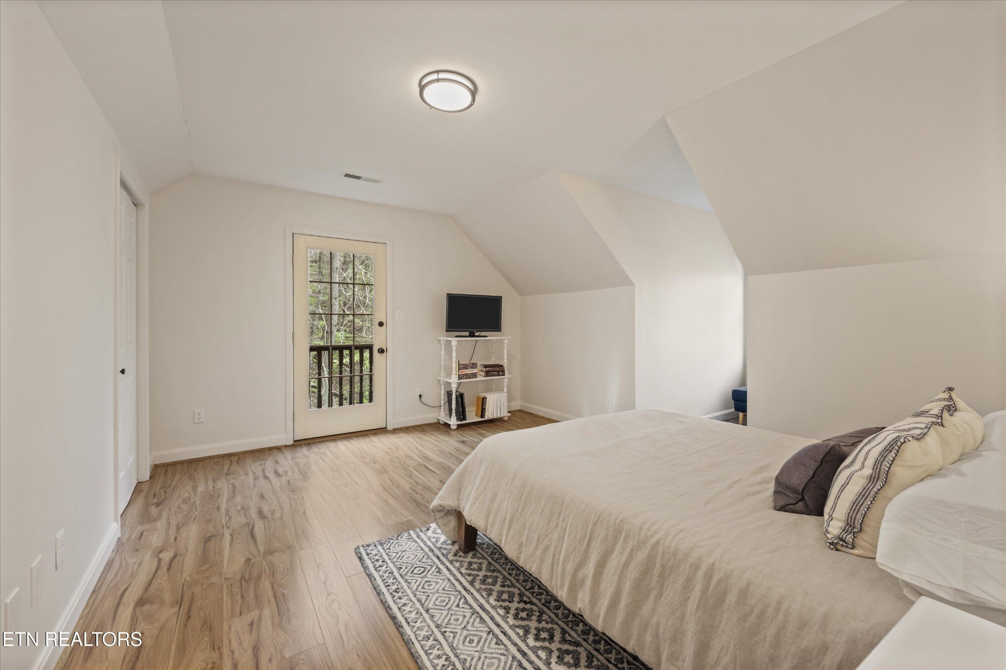 257 Lone Ridge Lane Heiskell, TN 37754 - Photo 35 of 60 a bedroom with a bed and a window