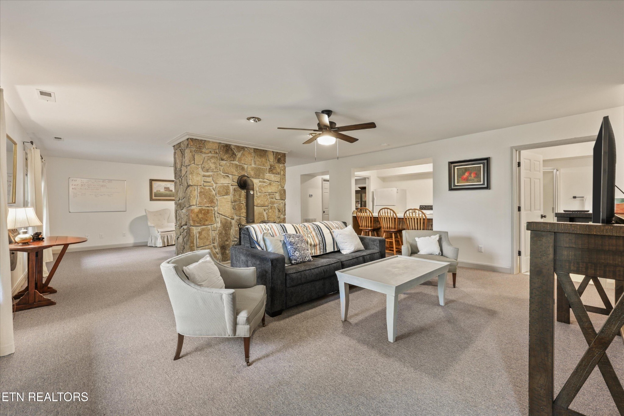 257 Lone Ridge Lane Heiskell, TN 37754 - Photo 41 of 60 a living room with furniture and a flat screen tv