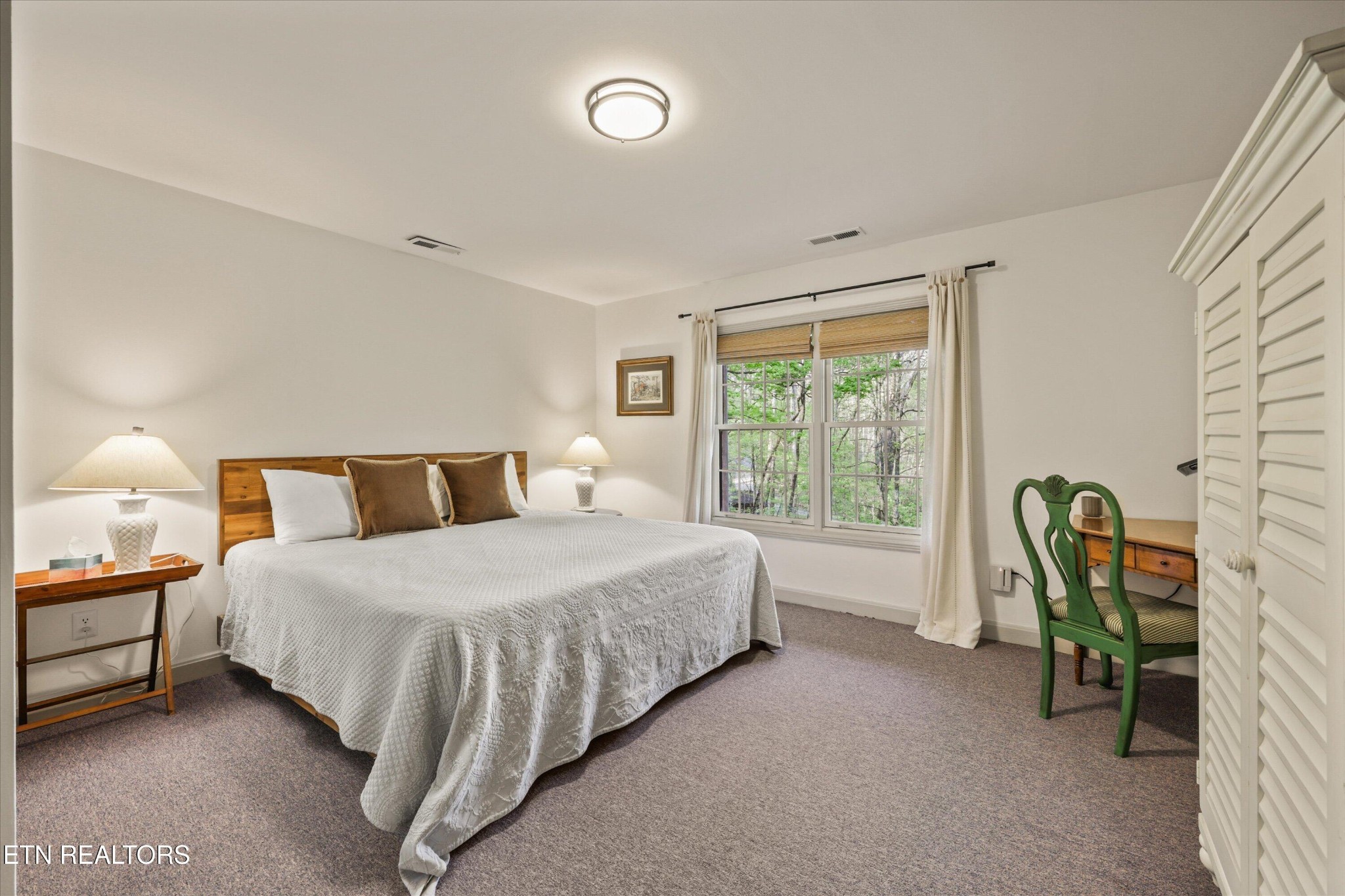 257 Lone Ridge Lane Heiskell, TN 37754 - Photo 48 of 60 a bedroom with a bed a table and chair