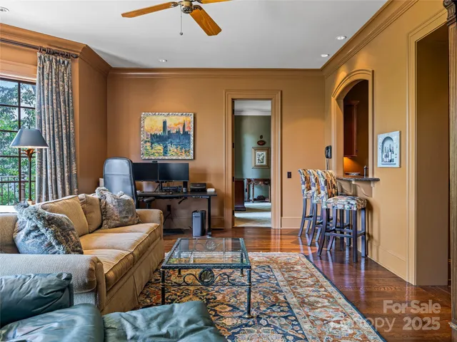a living room with furniture and a rug