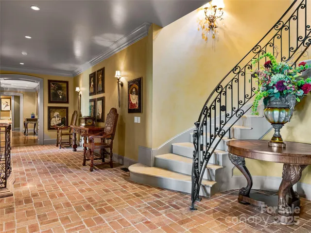a view of entryway dining room and hall with wooden floor