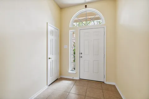 a view of an entryway with wooden floor