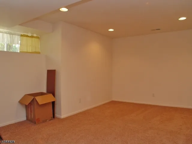an aerial view of a pool patio outdoor seating and green space