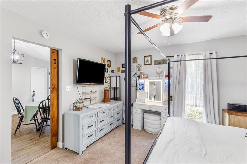 237 Mona Place Dallas, GA 30132 - Photo 15 of 28 a bedroom with furniture and a flat screen tv