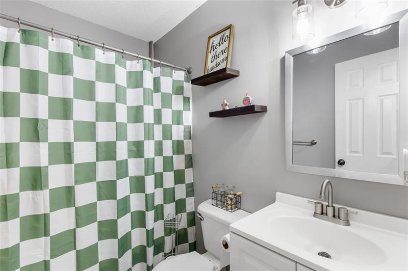 237 Mona Place Dallas, GA 30132 - Photo 20 of 28 a bathroom with a sink toilet and shower