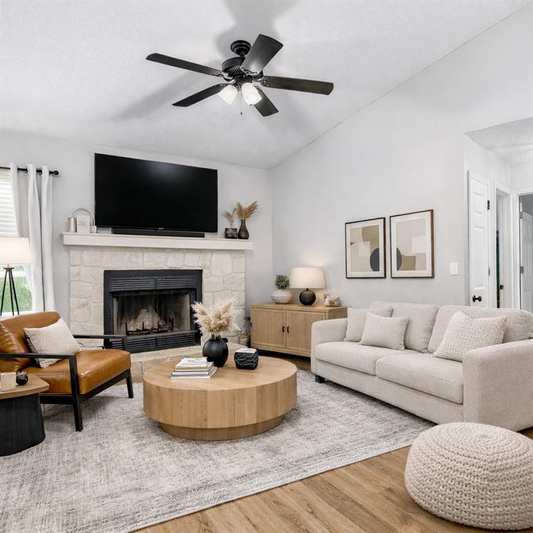 237 Mona Place Dallas, GA 30132 - Photo 2 of 28 a living room with furniture a flat screen tv and a fireplace