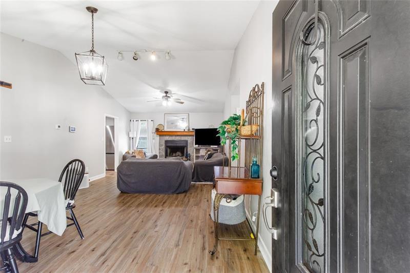 237 Mona Place Dallas, GA 30132 - Photo 4 of 28 a view of a dining room with furniture and wooden floor