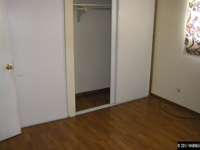 750 Wyoming Avenue Reno, NV 89503 - Photo 6 of 7 a view of an empty room with wooden floor and a window