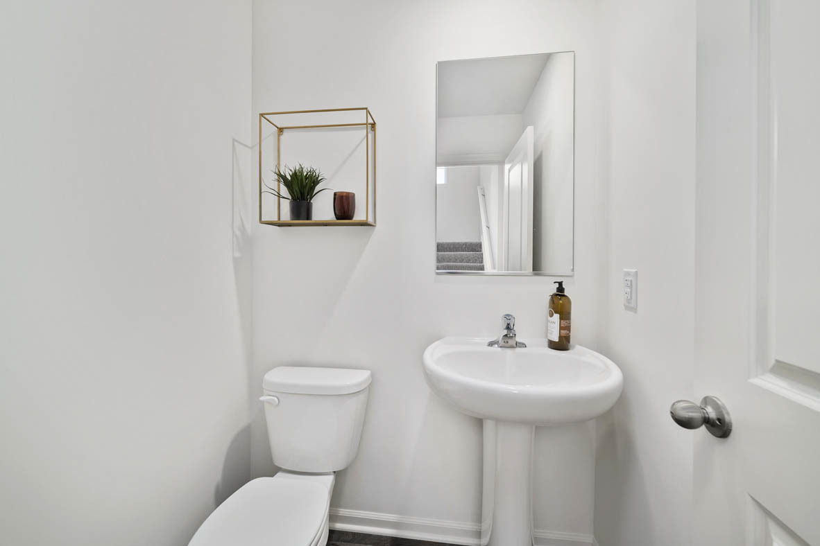 3743 Bailey Road Yorkville, IL 60560 - Photo 12 of 20 a bathroom with a toilet sink and mirror