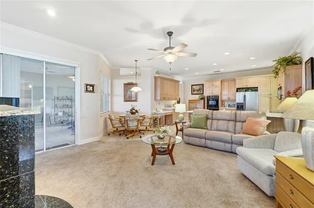 a large kitchen with a large counter top stainless steel appliances and cabinets