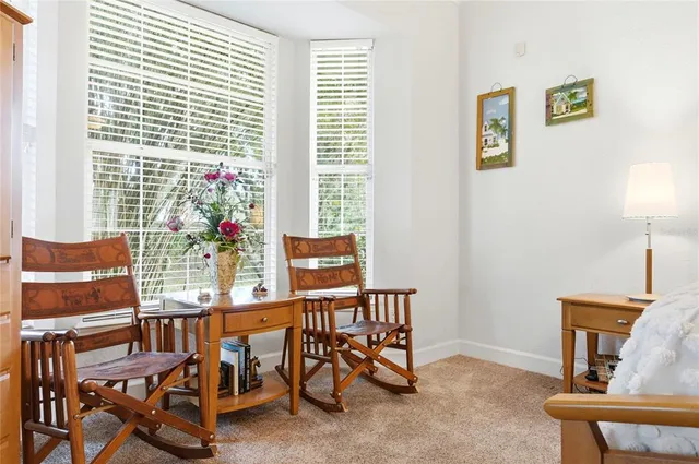 a spacious bathroom with a tub sink shower and a mirror