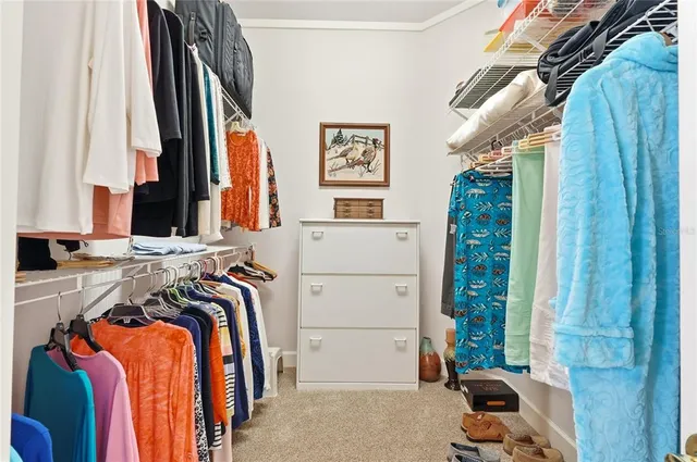 a bedroom with a bed and a table in it