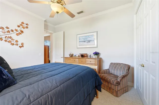 a bathroom with a double vanity sink large mirror and next to a window