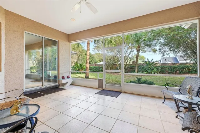 a view of a house with backyard and porch