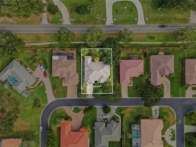 an aerial view of residential building and lake