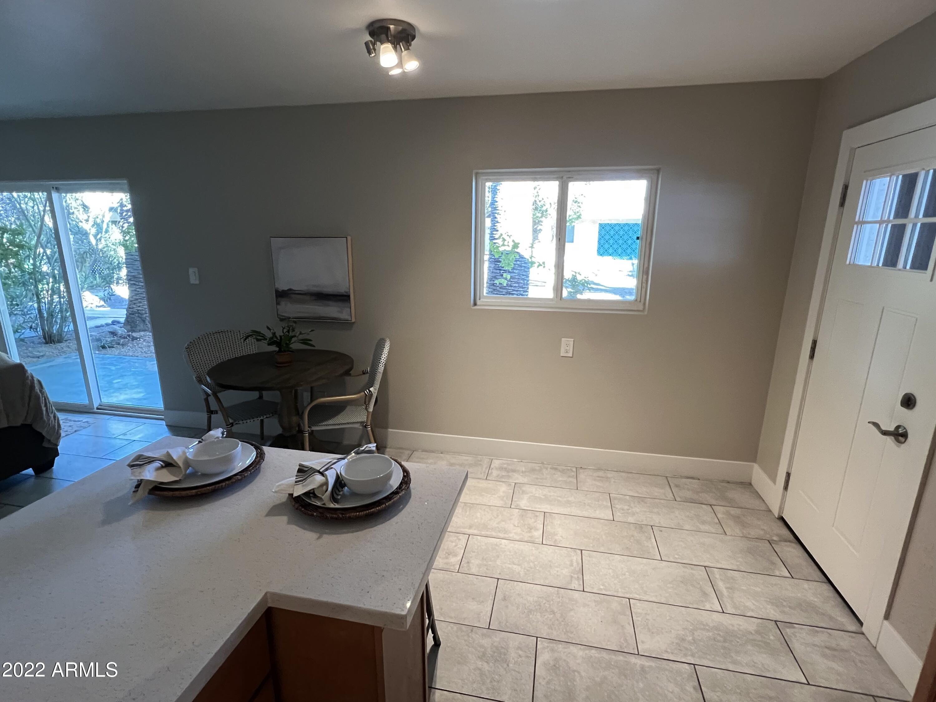 1250 East Bethany Home Road, Unit 17 Phoenix, AZ 85014 - Photo 5 of 25 a kitchen with a sink and a stove top oven
