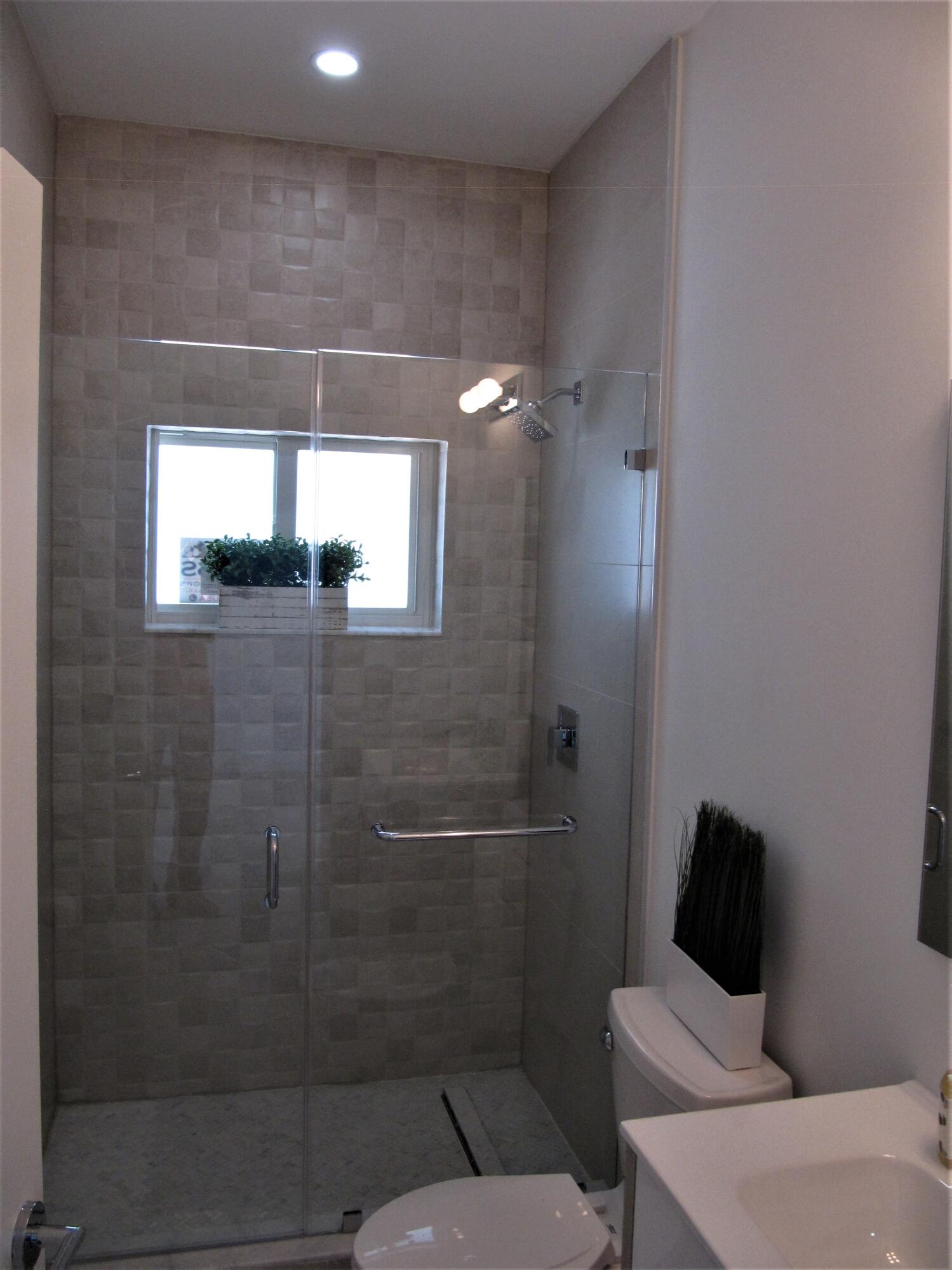 441 4th Road Key Largo, FL 33037 - Photo 11 of 18 a bathroom with a toilet and a shower