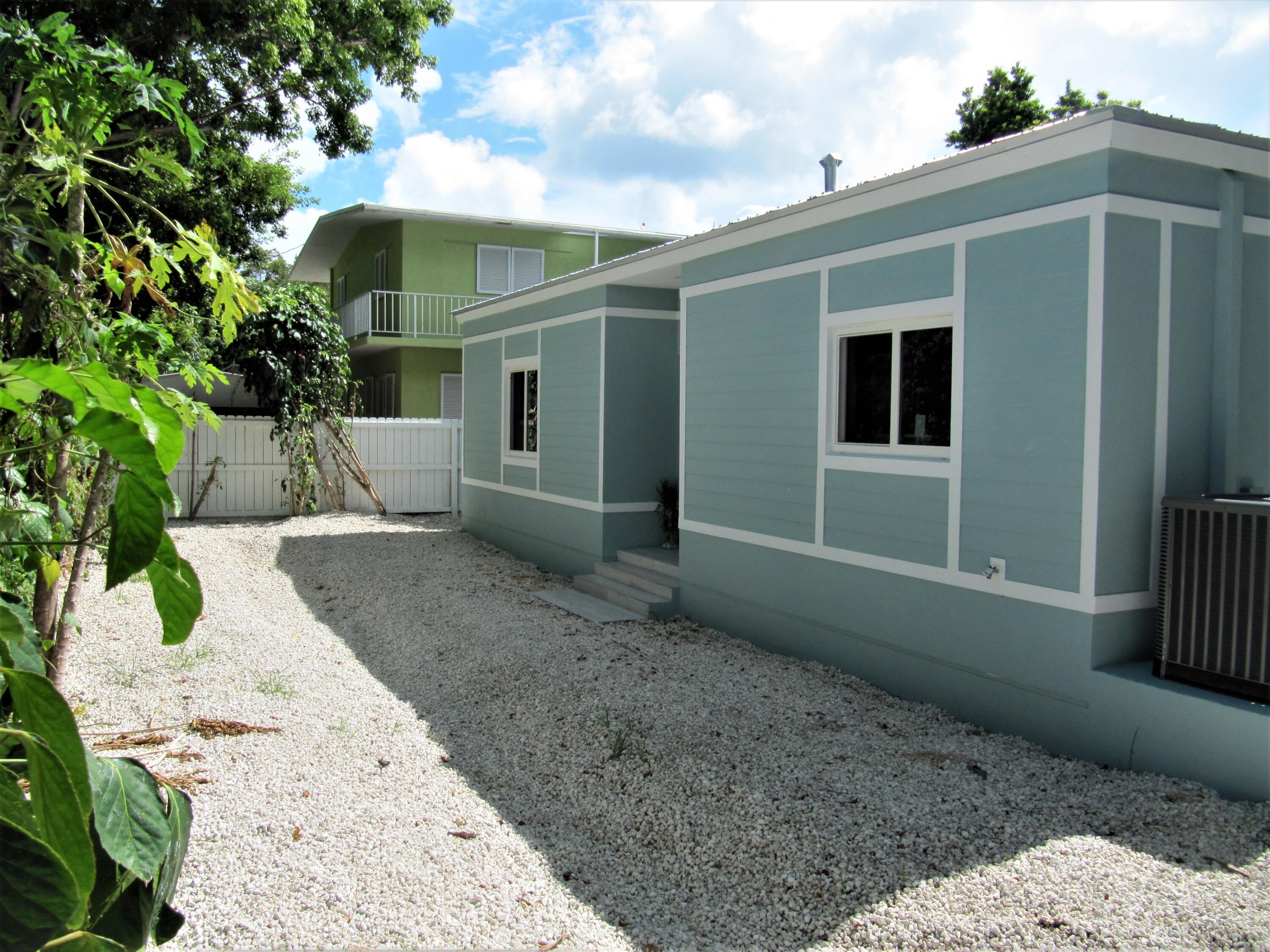 441 4th Road Key Largo, FL 33037 - Photo 17 of 18 a view of a house with a yard
