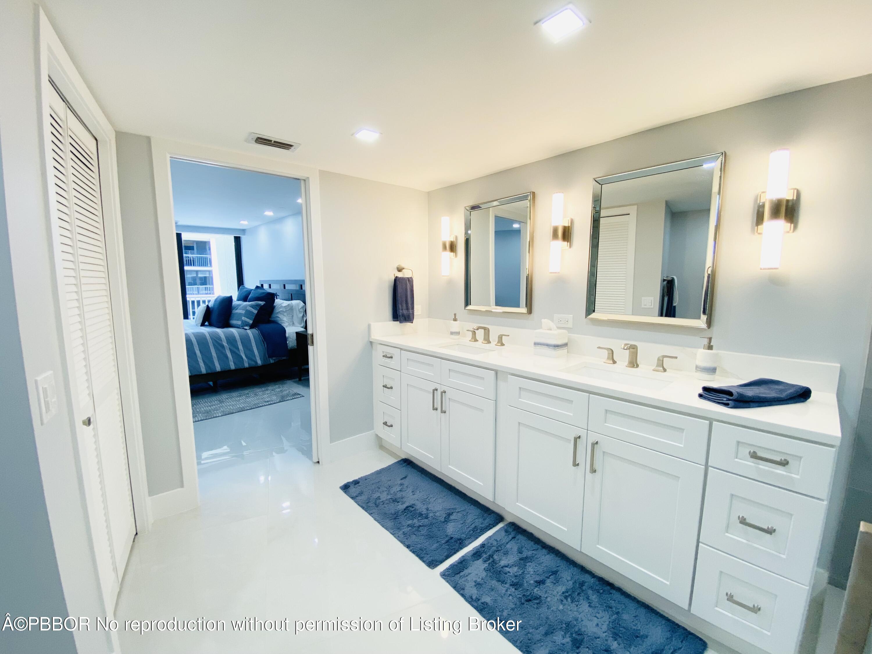 3360 South Ocean Boulevard, Unit 4FII Palm Beach, FL 33480 - Photo 22 of 32 a spacious bathroom with a double vanity sink and mirror