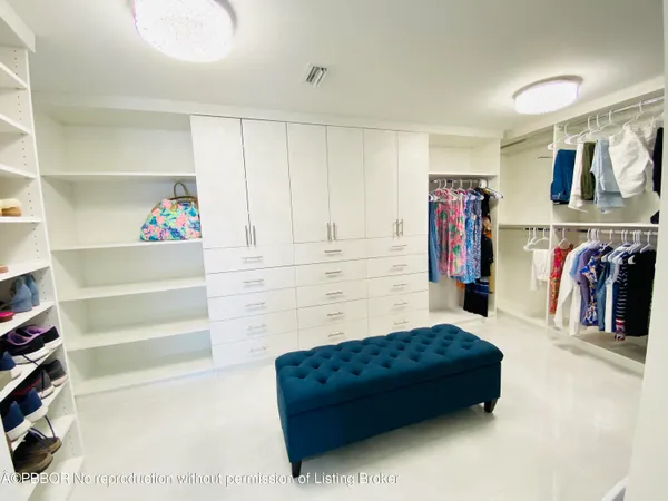 a living room with furniture and a closet