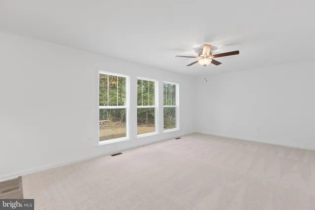 a view of a kitchen with a sink and a window
