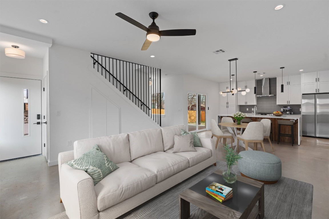 5603 Manor Road, Unit B Austin, TX 78723 - Photo 1 of 1 a living room with furniture kitchen view and a chandelier