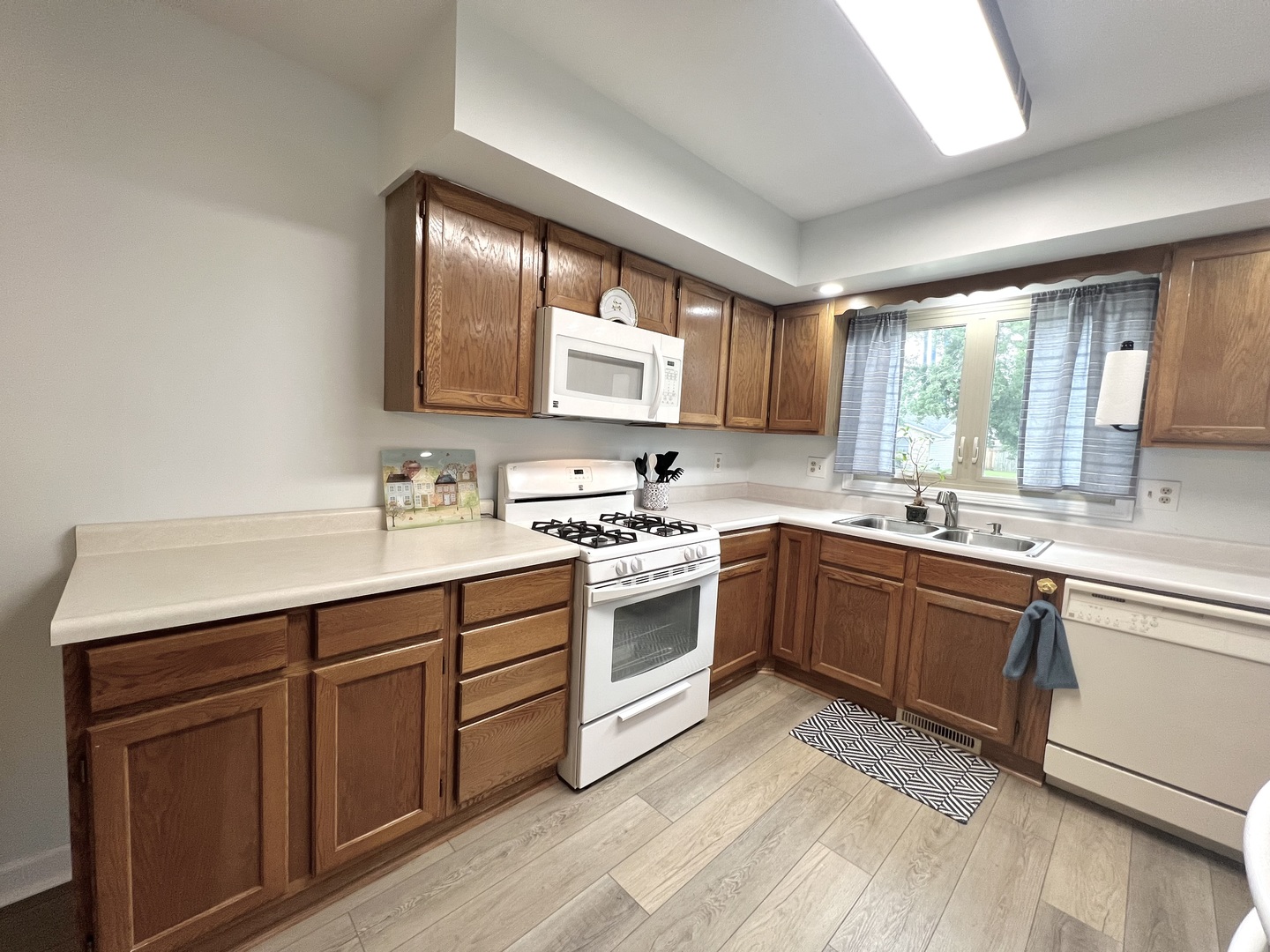 1201 Clark Street Rantoul, IL 61866 - Photo 11 of 24 a kitchen with sink cabinets and window