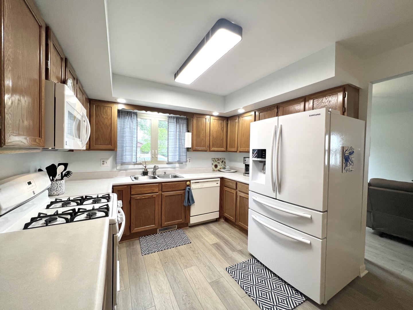 1201 Clark Street Rantoul, IL 61866 - Photo 12 of 24 a kitchen with a refrigerator and a sink