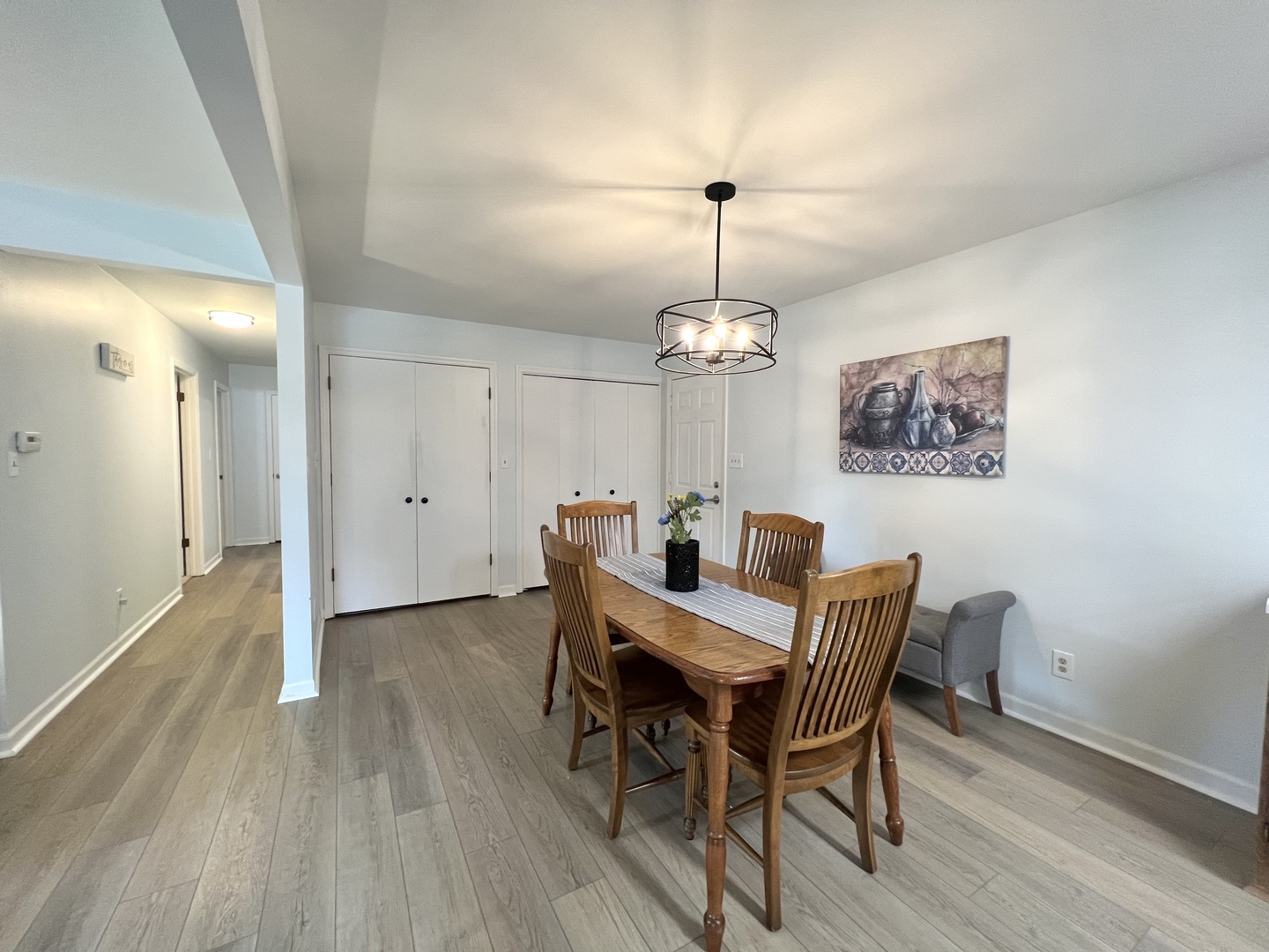 1201 Clark Street Rantoul, IL 61866 - Photo 14 of 24 a view of a dining room with furniture wooden floor and chandelier
