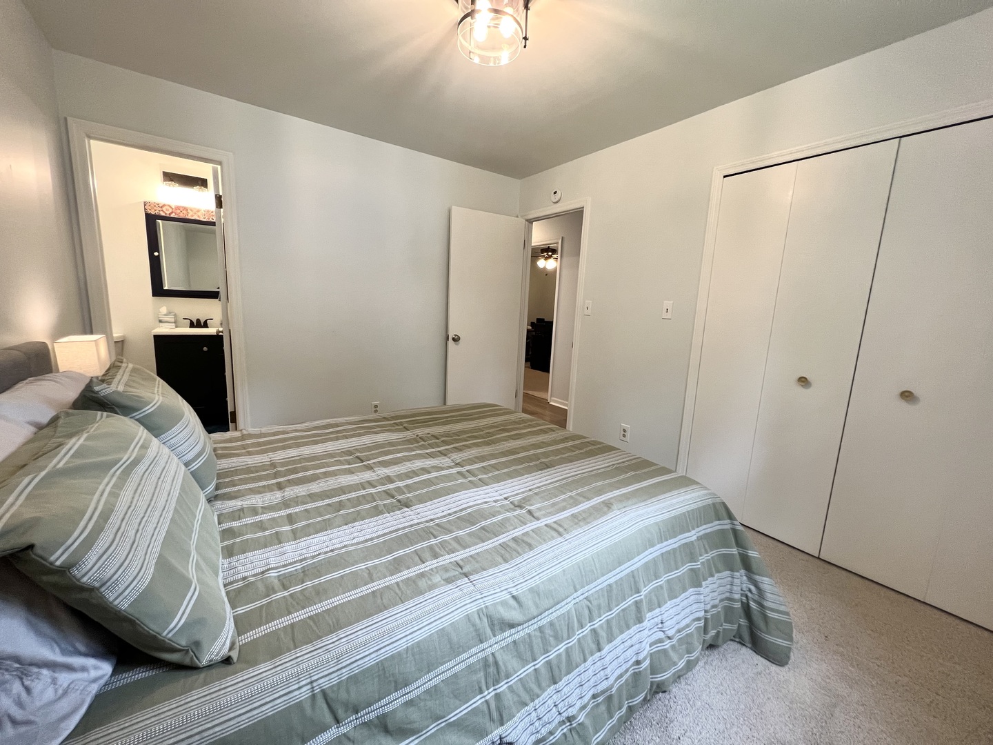 1201 Clark Street Rantoul, IL 61866 - Photo 17 of 24 a bedroom with a bed and a refrigerator