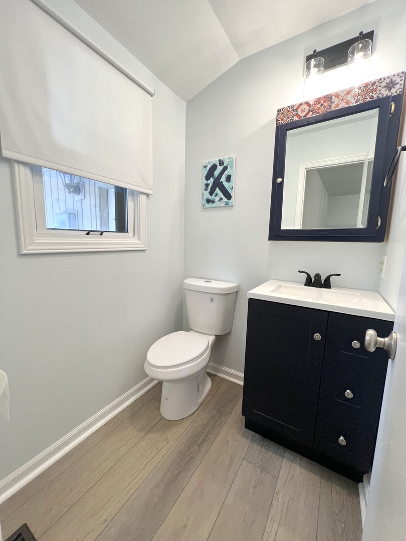 1201 Clark Street Rantoul, IL 61866 - Photo 18 of 24 a bathroom with a toilet sink and mirror