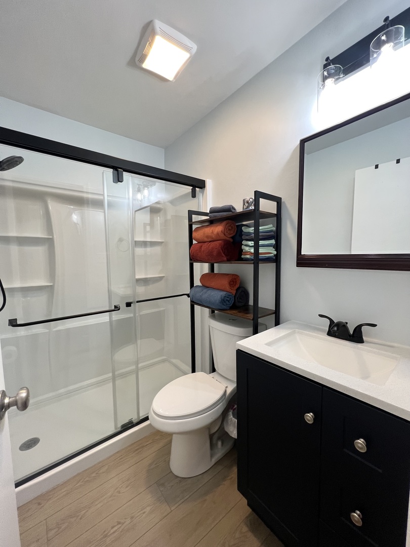 1201 Clark Street Rantoul, IL 61866 - Photo 20 of 24 a bathroom with a toilet a sink and mirror